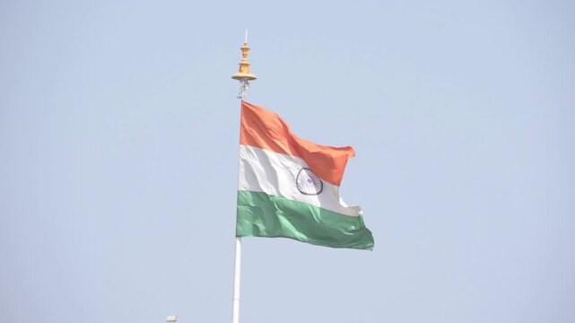 India&rsquo;s National Pride Soaring High Under a Clear Blue Sky, Capturing the Beauty and Spirit of the Indian Tricolor