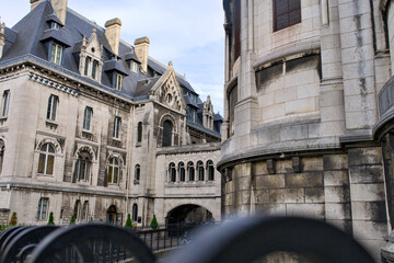 Historic Parisian stone mansard buildings and arched architectural passage, Paris © Moiseii Production