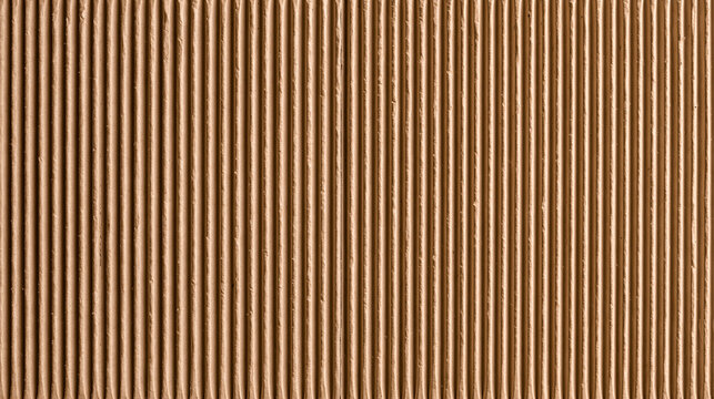 Full frame macro close up view of light brown corrugated cardboard paper sheet texture with vertical ridges for eco friendly packaging backdrop concept