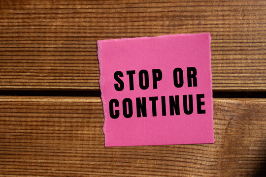 Stop or Continue text concept photo