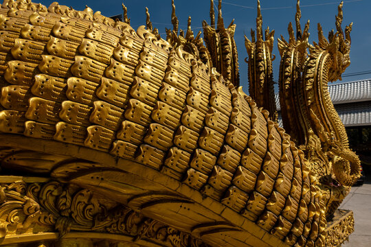Golden Naga sculptures at Wat Sri Panton in Nan Province, Thailand, showcasing ornate Buddhist architecture, sacred craftsmanship and Northern Lanna heritage