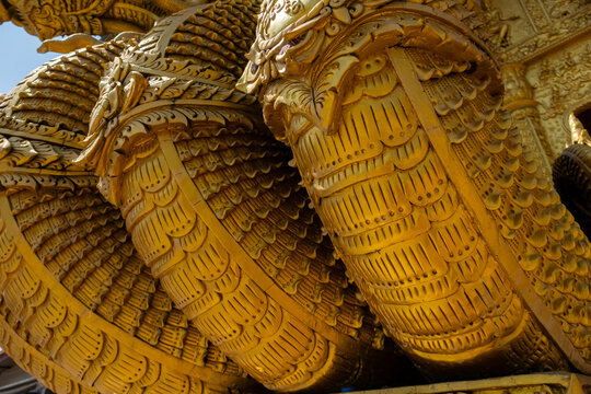 Golden Naga sculptures at Wat Sri Panton in Nan Province, Thailand, showcasing ornate Buddhist architecture, sacred craftsmanship and Northern Lanna heritage
