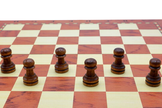 Wooden chess board. Black pawns.
