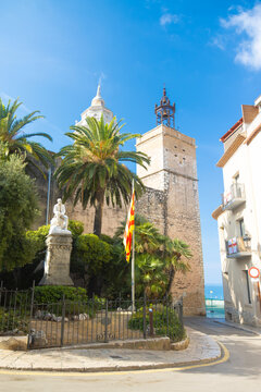 Historic Square and Church Tower with Palm Trees in Sitges, Spain