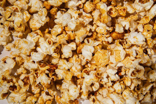 Sweet golden caramel popcorn texture background