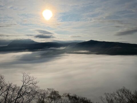 Sunrise above a sea of clouds and mountains at Lake Mashu, Hokkaido, Japan