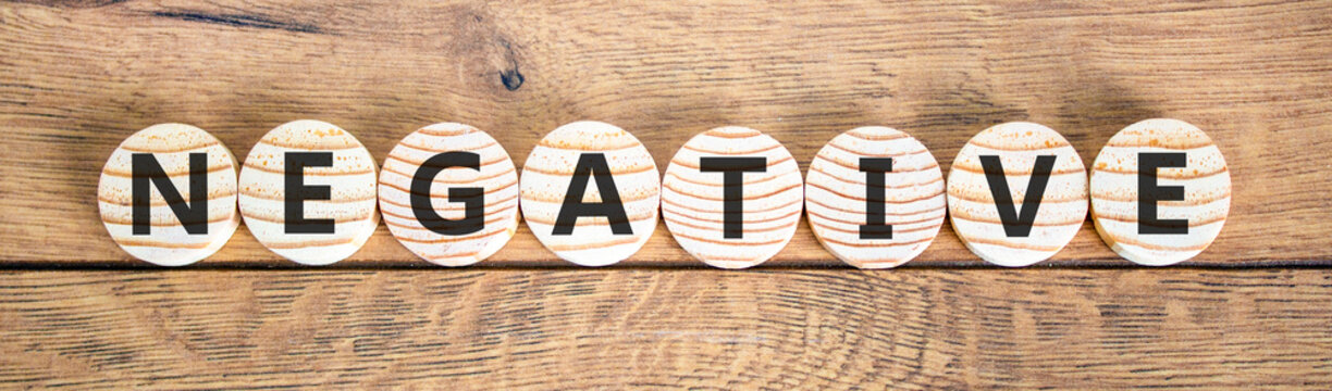 Negative word symbol. Concept word Negative on beautiful wooden circles. Beautiful wooden background. Business support help negative word concept. Copy space.