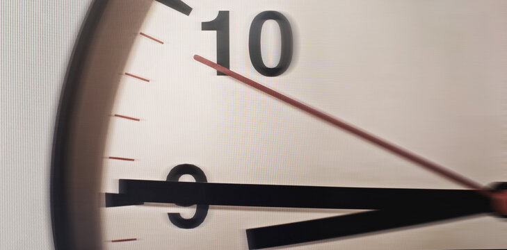 Clock face with blurred hands indicating urgency