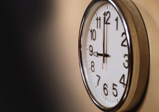 Wall clock showing nine o'clock time concept