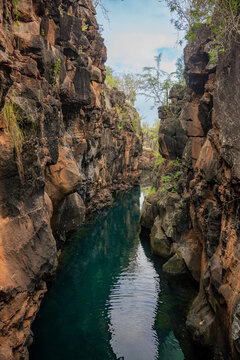 Volcanic gorge with clear water in Galapagos Islands
