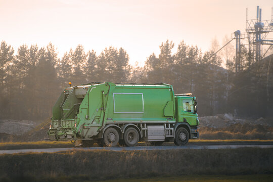 Recycling vehicle traveling in open landscape