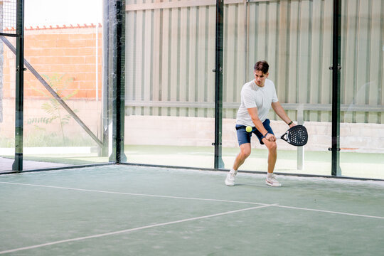 Padel player prepare to return ball during tournament match