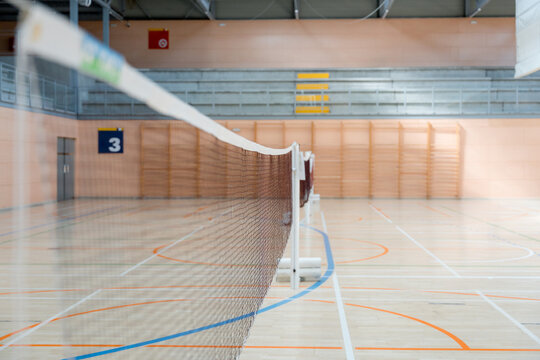 Badminton net detail in an indoor tournament court