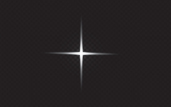 A bright four pointed star flare isolated on a solid black background for graphic design overlays