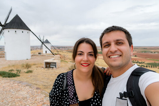 Couple at Alcazar de San Juan windmill in Spain