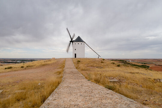Historic windmill on hill in Alcazar de San Juan, Spain
