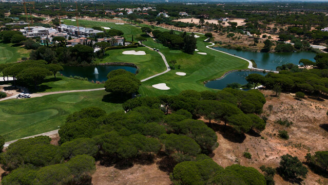Golfers on the golf course, aerial view.