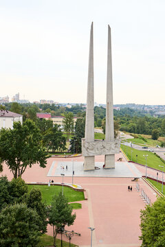 Vitebsk, Belarus - August, 16 2026: High-angle shot of Three Bayonets Memorial Complex on Victory Square in Vitebsk, Belarus, featuring concrete obelisks, bas-relief carvings, green lawn and cityscape