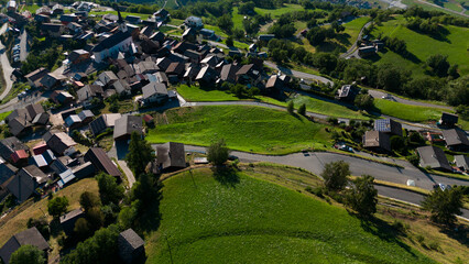 Fototapeta premium Village landscape with alps mountains 