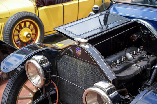 Open hood detail of centennial 1914 Maxwell Model 25 vintage oldtimer showing inline 4 cylinder engine, radiator badge and acetylene headlights, close-up, Palic, Serbia, Jul 5, 2026