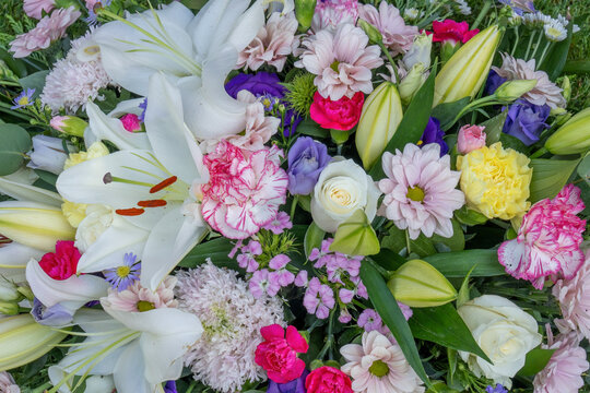Close Up Funeral Floral Spray Tribute with White Lilies