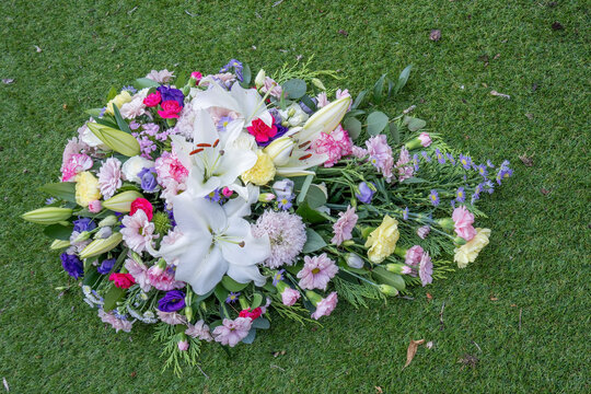 Funeral Floral Spray Tribute on Green Grass Lawn