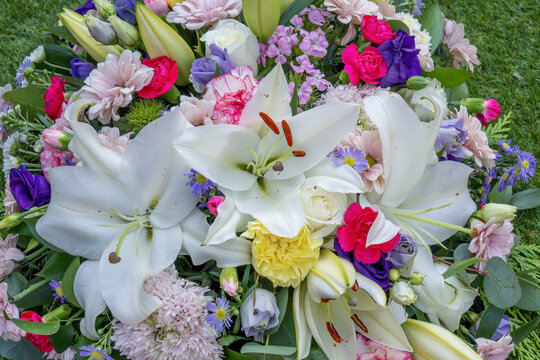 Close Up Funeral Floral Spray Tribute with White Lilies
