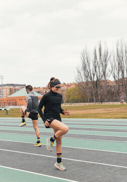 Female athlete warm up on outdoor running track
