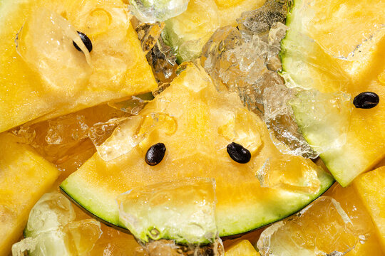 Yellow watermelon slice with ice for refreshing summer dessert