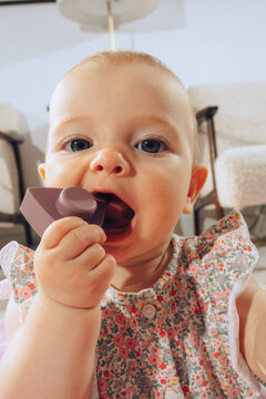 baby playing with baby teether