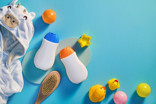 Baby bath time essentials on a blue background