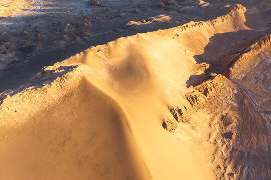 Golden desert erosion patterns in Valle de Marte, Chile