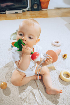 baby playing with baby teether