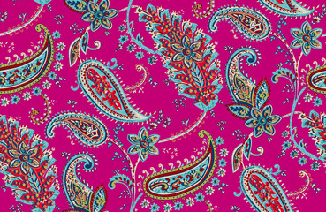 Seamless repeating pattern with paisley motifs placed at different angles, balanced by smaller floral elements and filler © Venkatsai