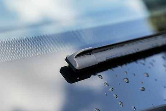 Electric car windshield wiper with water droplets