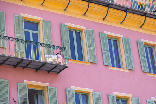 Colorful historic facade with shutters in old Nice, France