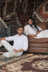 Romantic Indian couple sharing an intimate moment while embracing in a beautifully decorated...