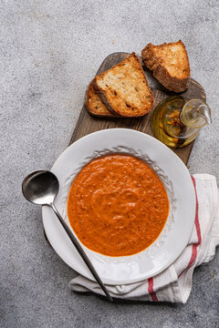 Tomato veloute soup with toasted bread and olive oil