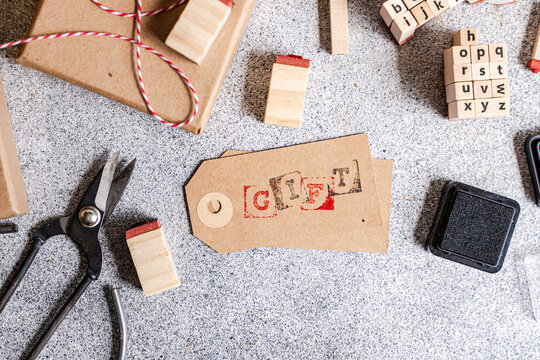 Gift wrapping supplies with stamped tag and twine