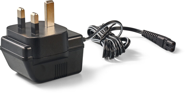 black uk power adapter plug isolated white background, 3-pin mains charger with bundled wire and figure-8 connector, electrical equipment in side view