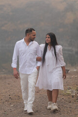 Romantic Indian couple sharing an intimate moment while embracing in a beautifully decorated...