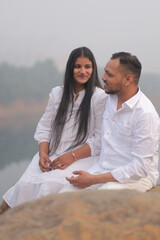 Romantic Indian couple sharing an intimate moment while embracing in a beautifully decorated...