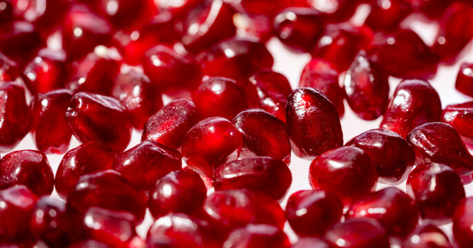 Pomegranate garnet fruit background. Red Background of grenade fruit. Rube juicy pomegranate background. Fresh pomegranate arils background.