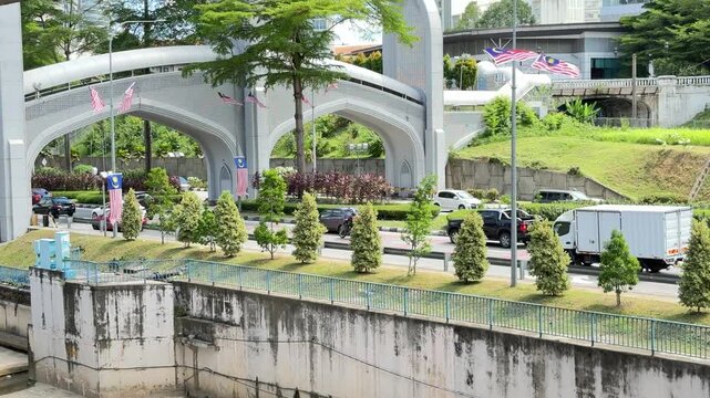 traffic under pedestrian walkway for transfer between the Bandaraya LRT station and Bank Negara KTM station in Kuala Lumpur Malaysia. Pedestrian overpass