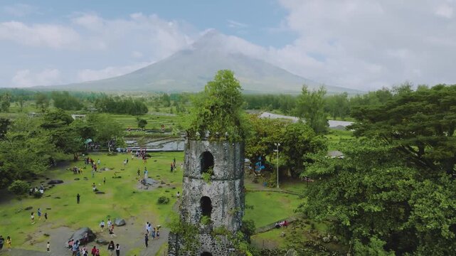 4K Drone View of Cagsawa Ruins and Mayon Volcano in Albay Philippines
the historic Cagsawa Ruins belfry surrounded by tourists, with the iconic Mayon Volcano standing grandly in the background