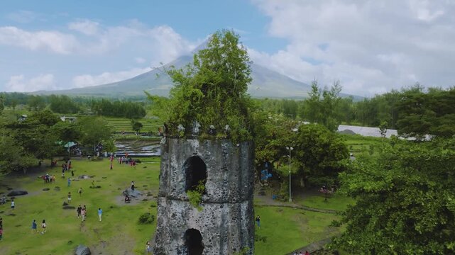 4K Drone View of Cagsawa Ruins and Mayon Volcano in Albay Philippines
the historic Cagsawa Ruins belfry surrounded by tourists, with the iconic Mayon Volcano standing grandly in the background