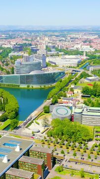 Vertical video. Strasbourg, France. The complex of buildings is the European Parliament, the European Court of Human Rights, the Palace of Europe. Drone footage. Rich colors