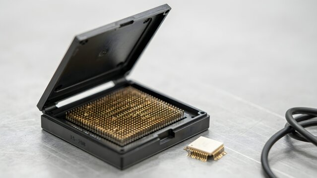 Electronic computer chip in detailed packaging with pins exposed