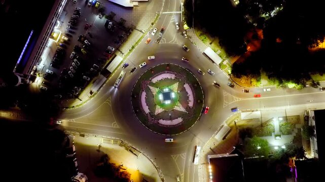 Simferopol, Crimea. Car traffic on Sovetskaya Square. Night time. Drone footage, HEAD OVER SHOT with rotation
