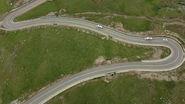 Vehicles Rounding Sharp Transalpina Hairpin